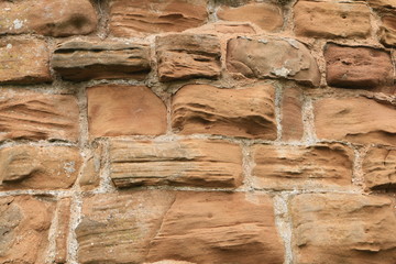 Close up of sandstone blocks from an outside perimeter wall.  Close up of sandstone blocks from an outside perimeter wall of an English castle.