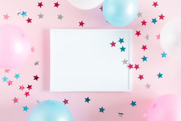 Festive pink background. Shining stars, photo frame and balloons on light pink pastel background. Birthday holiday concept. Flat lay, top view, copy space