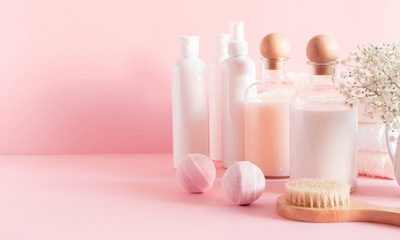 Obraz na płótnie Canvas Soft light bathroom decor for advertising, design, cover, set of cosmetic bottles, light pink pastel background. mock up