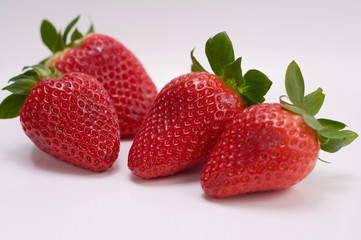 close up picture of fresh strawberries with white background