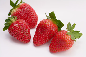 close up picture of fresh strawberries with white background