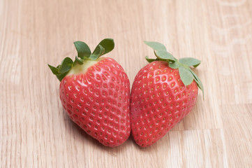 close up fresh strawberries with natural wood background
