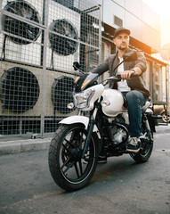 Obraz na płótnie Canvas man with motorcycle near air conditioner