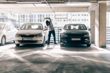 Burglar man stealing a car