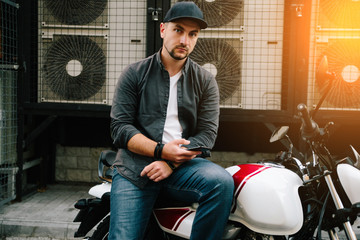 man with motorcycle near air conditioner