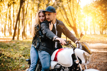 Plakat young couple on motorcycle laugh