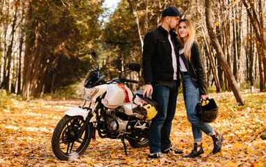 young couple on motorcycle laugh