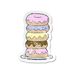 retro distressed sticker of a cartoon plate of donuts