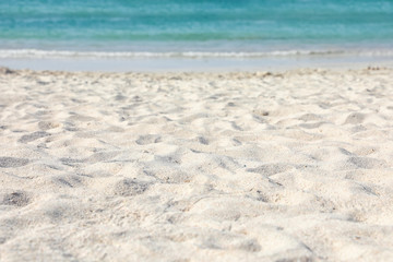 Fototapeta na wymiar Beach with clean hot sand on sunny day