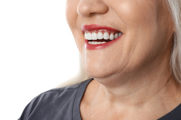 Obraz premium Smiling woman with perfect teeth on white background, closeup
