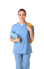 Young medical student with backpack on white background