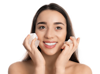 Young woman with ice cubes on white background. Skin care