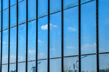 Sky and cloud reflection in windows of modern skyscrapers