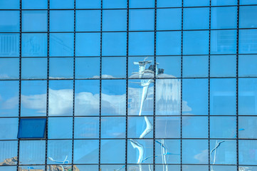 Sky and cloud reflection in windows of modern skyscrapers