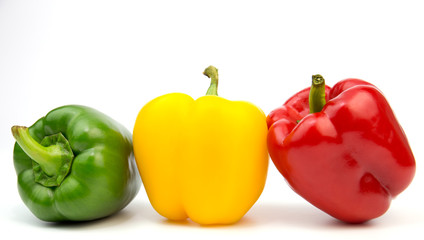 Yellow, red, green, fresh bell pepper isolated on white background 