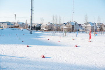Ski trail in winter. The track in the stadium among the houses. Healthy lifestyle.