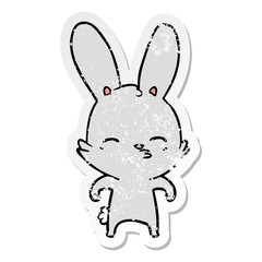 distressed sticker of a curious bunny cartoon