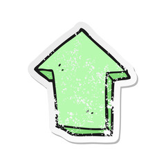retro distressed sticker of a cartoon arrow pointing