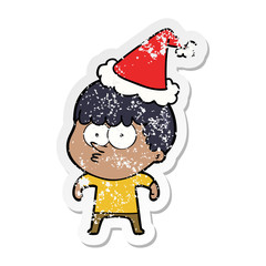 distressed sticker cartoon of a curious boy wearing santa hat