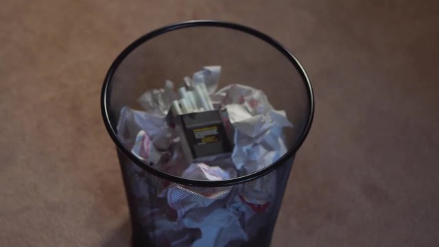 Deciding to quit smoking and throw away pack of cigarettes
