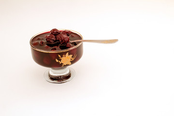 Cherry cherry jam and a glass of milk.