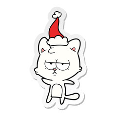 bored sticker cartoon of a cat wearing santa hat