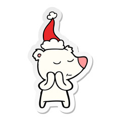 happy sticker cartoon of a polar bear wearing santa hat