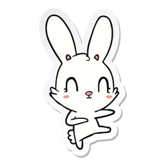 Fototapeta na wymiar sticker of a cute cartoon rabbit dancing