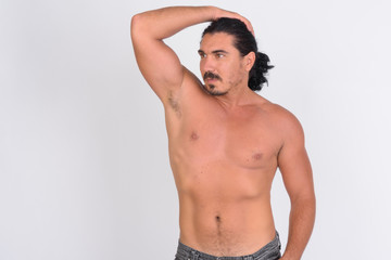 Fototapeta premium Shirtless handsome macho man with mustache brushing hair back