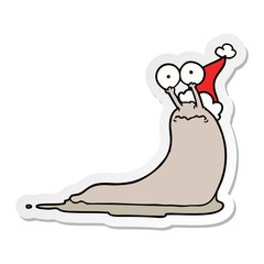 sticker cartoon of a slug wearing santa hat