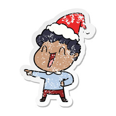 distressed sticker cartoon of a happy man wearing santa hat