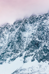 Fototapeta na wymiar Mountain ridge covered with snow, winter in mountain valley