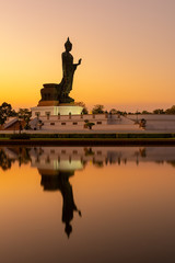 Big Buddha statue on sunset sky