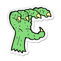 sticker of a cartoon monster claw