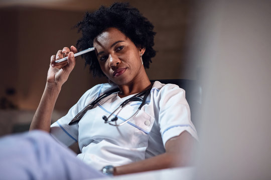Portrait of pensive African American female nurse.