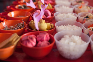 Food offerings on a table to appease the wandering spirits during the Chinese Hungry Ghost Festival 