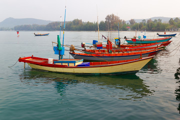 Fishing boats moored at dock Fisherman way of life in Thailand