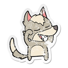 distressed sticker of a cartoon wolf laughing