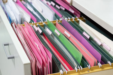 Files document of hanging file folders in a drawer in a whole pile of full papers, at work office Bangkok Thailand Business Concept 