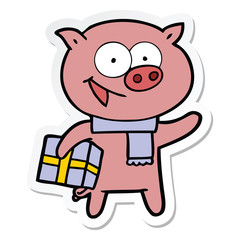 sticker of a cheerful pig with christmas gift