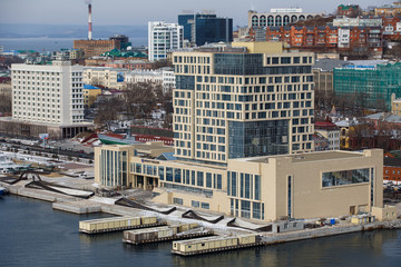 2013 - Sea facade in the capital of the Far East, the city of Vladivostok. Sea trading port with ships. Drifting ships in the raid.	