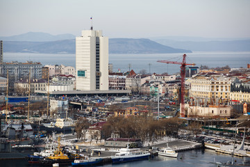 2013 - Sea facade in the capital of the Far East, the city of Vladivostok. Sea trading port with...