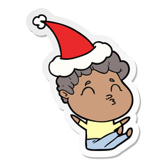 sticker cartoon of a man pouting wearing santa hat