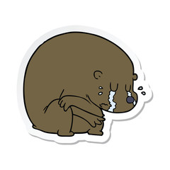 sticker of a crying cartoon bear