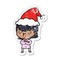 distressed sticker cartoon of a woman wearing santa hat