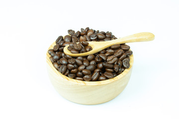 coffee beans in wood bowl isolated on white background