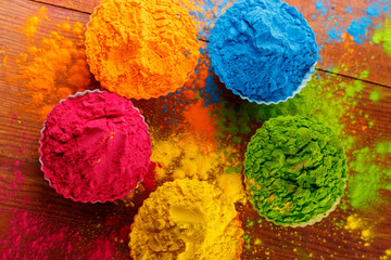 Holi color powder. Organic Gulal colours in bowl for Holi festival, Hindu tradition festive