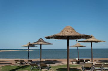 Beach with chairs and umbrellas