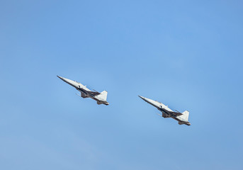 fighter jet military aircrafts flying with high speed  on blue sky background