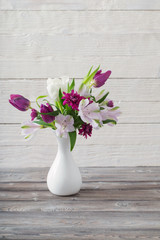 spring flowers in white vase